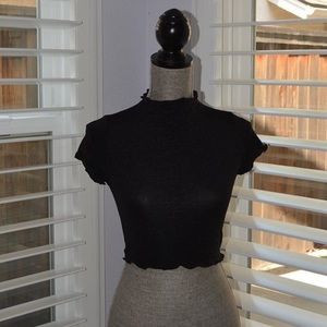 Cute cropped black top with ruffle details